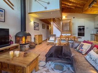 Open plan living area with log fire