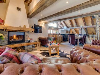 Large family living area with log fire